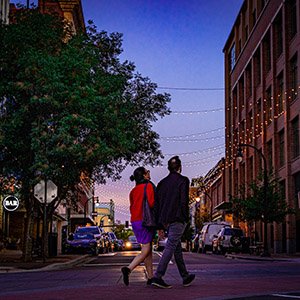 Two people walking on Parrish Street in downtown Durham, NC