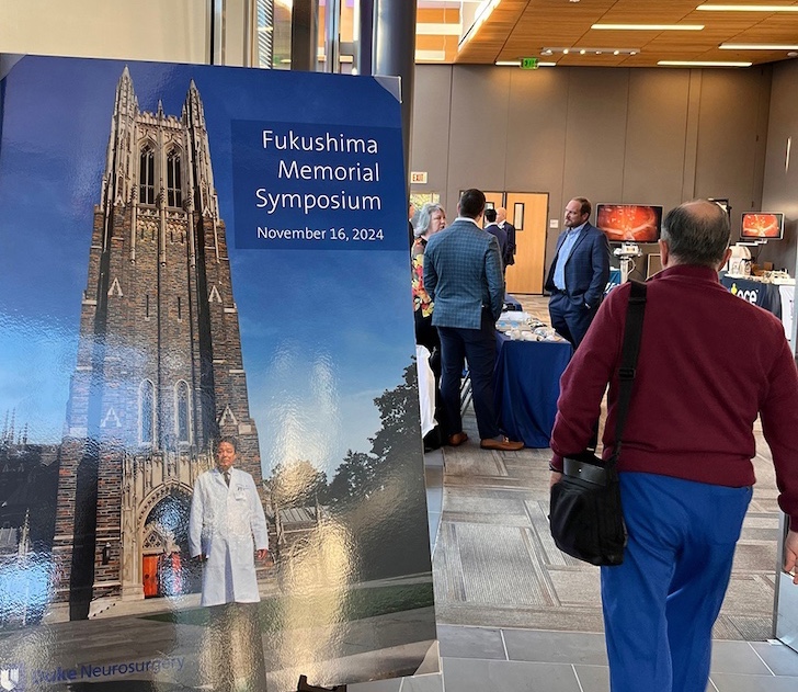 Attendee walking in the Fukushima conference