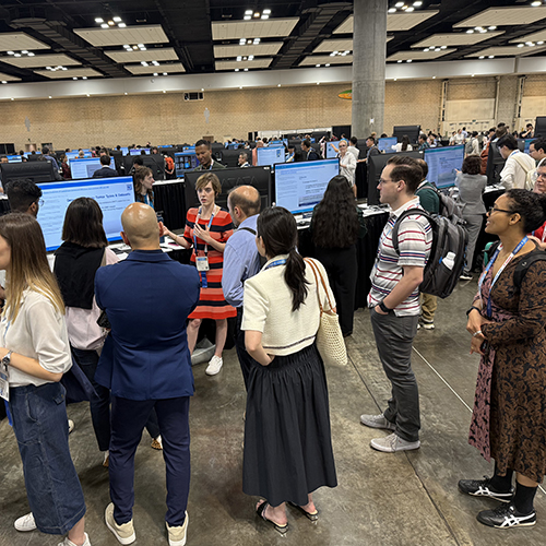 A group of people listening to a speaker