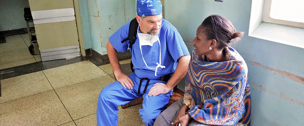 Dr. Haglund Speaking with a patient in Uganda