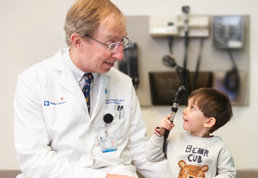 Dr. Fuchs with a young patient