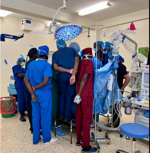 Neurosurgery trainees watch a surgery in Uganda