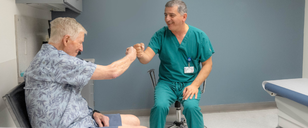 Patient gives a physician a fist bump. 