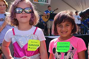 Two young girls enjoying the Angels Among Us event at Duke