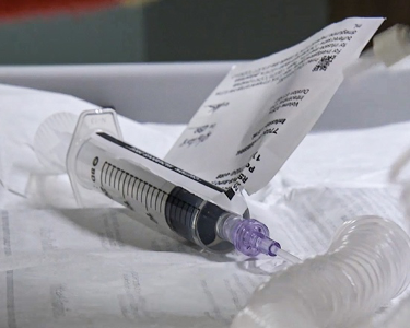 A syringe on a white background