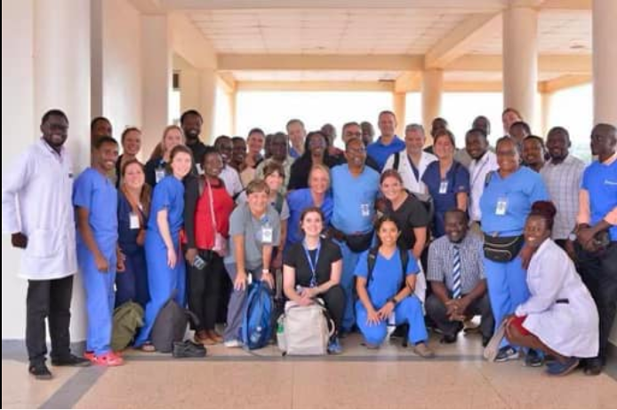 Duke volunteers and Ugandan care providers in a group shot