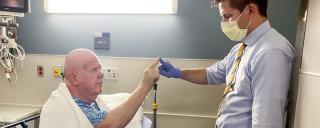 Dr. Harward with a patient after performing a HIFU procedure