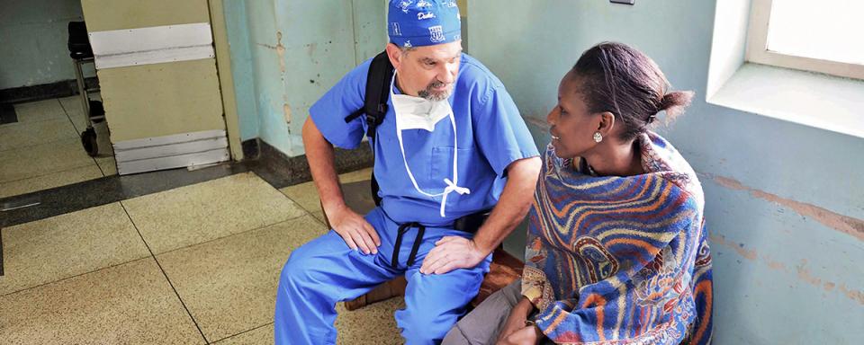 Dr. Haglund Speaking with a patient in Uganda