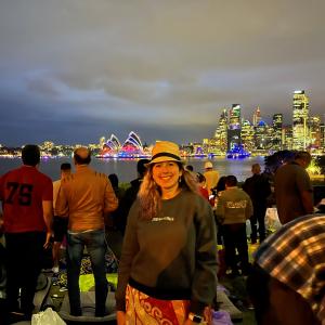 Heather Moffitt smiles in front of the opera house in Sydney, Australia before the New Year's fireworks.